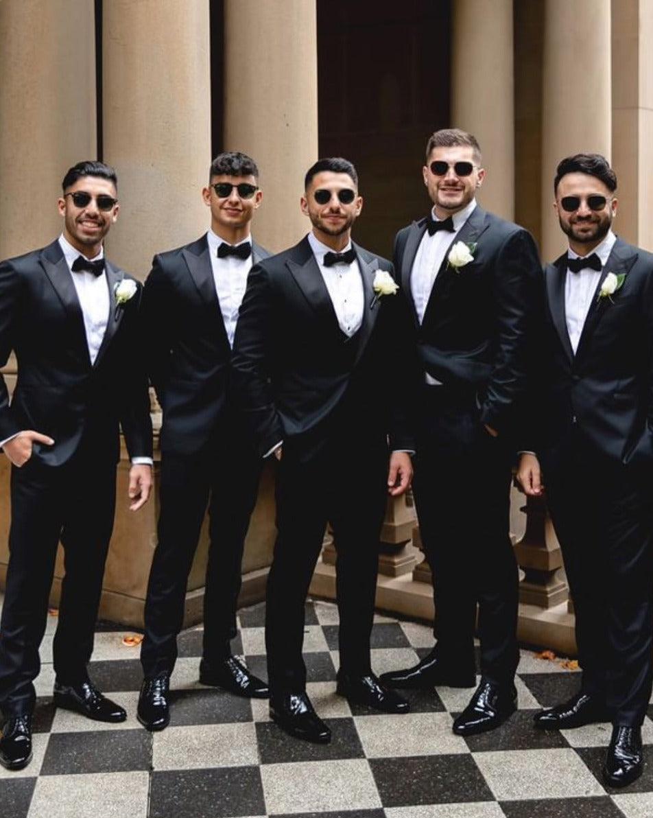 Groomsmen in custom made black tuxedo suits, white shirts and bowties by Alex Goodman, Sydney